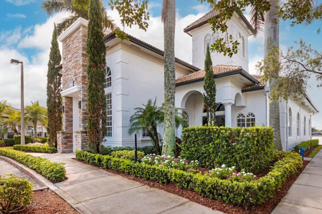 Exterior of leasing building with lots of trees and bushes