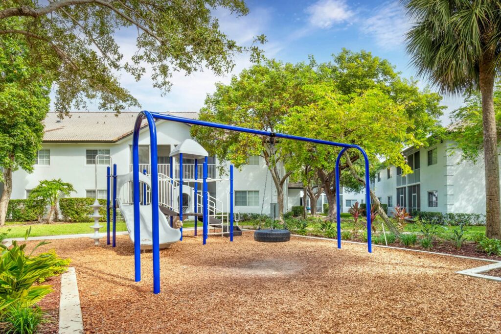 Kids playground with tire swing and slides