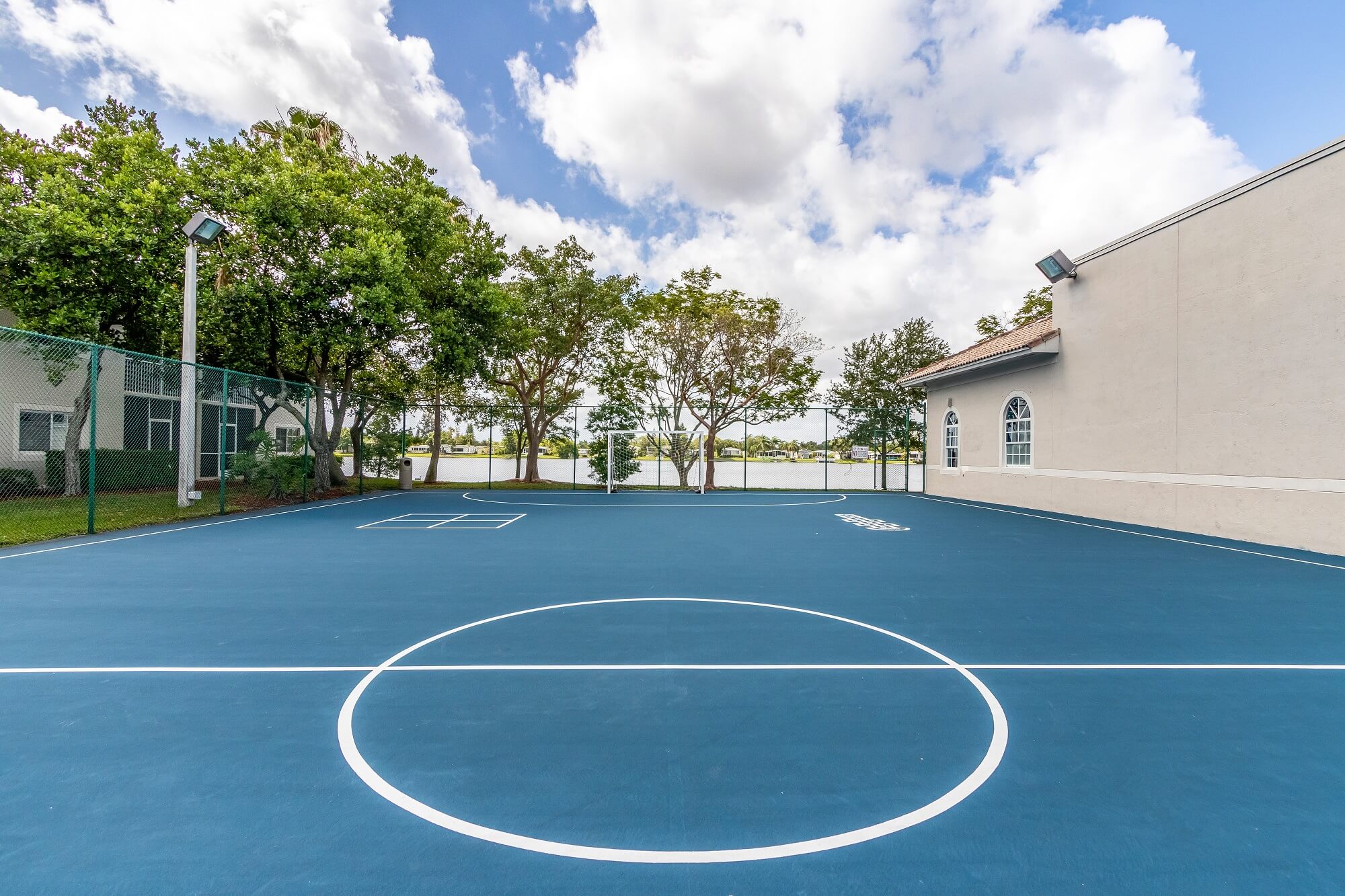 Exterior multi use sport court with view od lake in the background